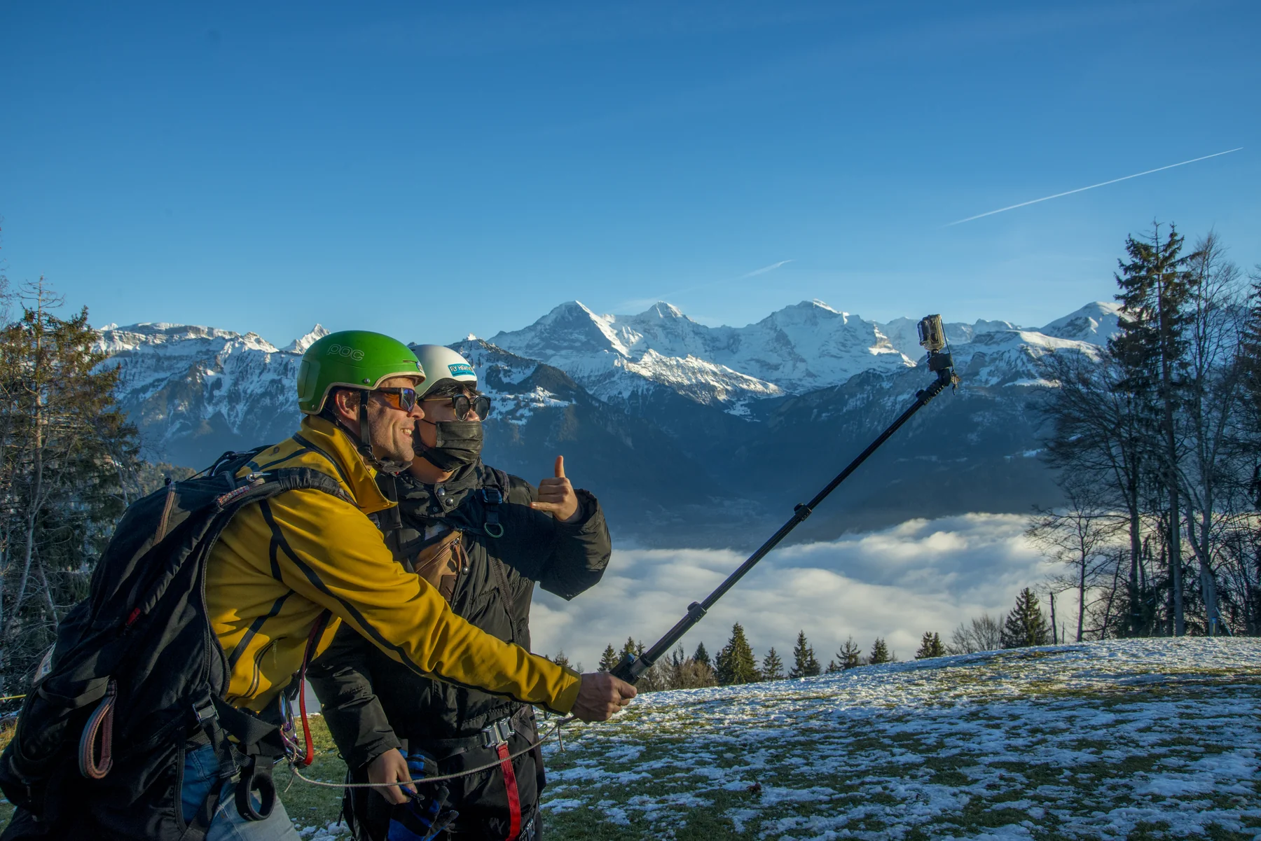 Paragliders flying above the mountains near Interlaken