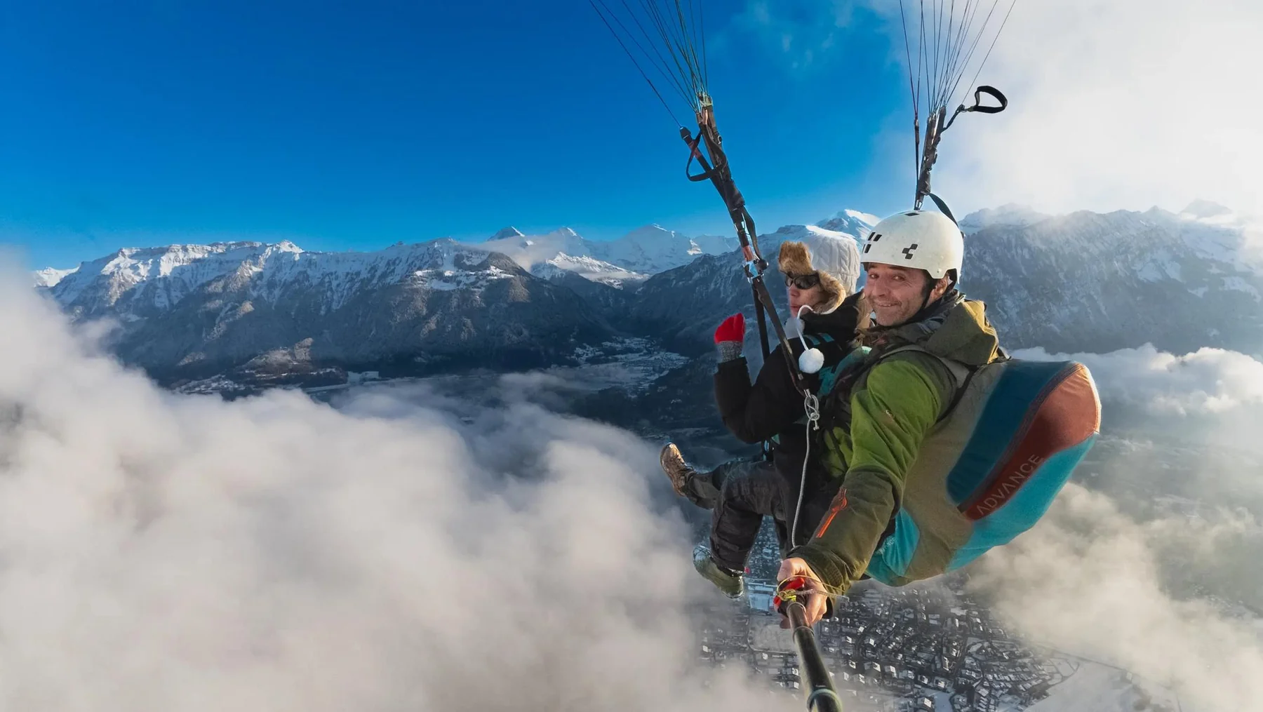 Paragliders flying above the mountains near Interlaken